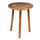 A 19TH CENTURY SMALL ELM CRICKET TABLE the thick highly figured top raised on three slightly splayed