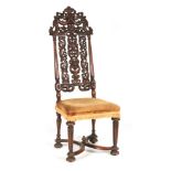 A WILLIAM AND MARY WALNUT SIDE CHAIR with pierced carved floral back, upholstered seat and