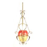 AN ART NOUVEAU BRASS FRAMED HANGING GAS LIGHT with turned stem and stylised scrollwork mounts with