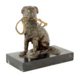 A 19TH CENTURY NOVELTY BRONZE INKWELL modelled as a seated dog inset with amber glass eyes and