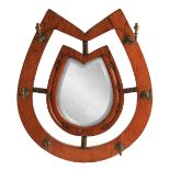 A LATE 19TH CENTURY OAK HORSE SHOE SHAPED HANGING HALL MIRROR with centre looking glass and six
