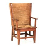 A LATE 19TH CENTURY OAK ORKNEY CHAIR OF SMALL SIZE with a screwed framework, open arms and drop-in