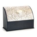 AN ELIZABETH II BLUE LEATHER FITTED STATIONERY BOX WITH HINGED EMBOSSED SILVER CURVED FRONT 22.5cm