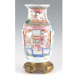 A CHINESE REPUBLIC PORCELAIN VASE decorated with figures set in a landscape with mountains and
