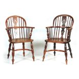A MATCHED PAIR OF 19TH CENTURY NOTTINGHAMSHIRE YEW WOOD WINDSOR ARMCHAIRS with shaped fret cut splat