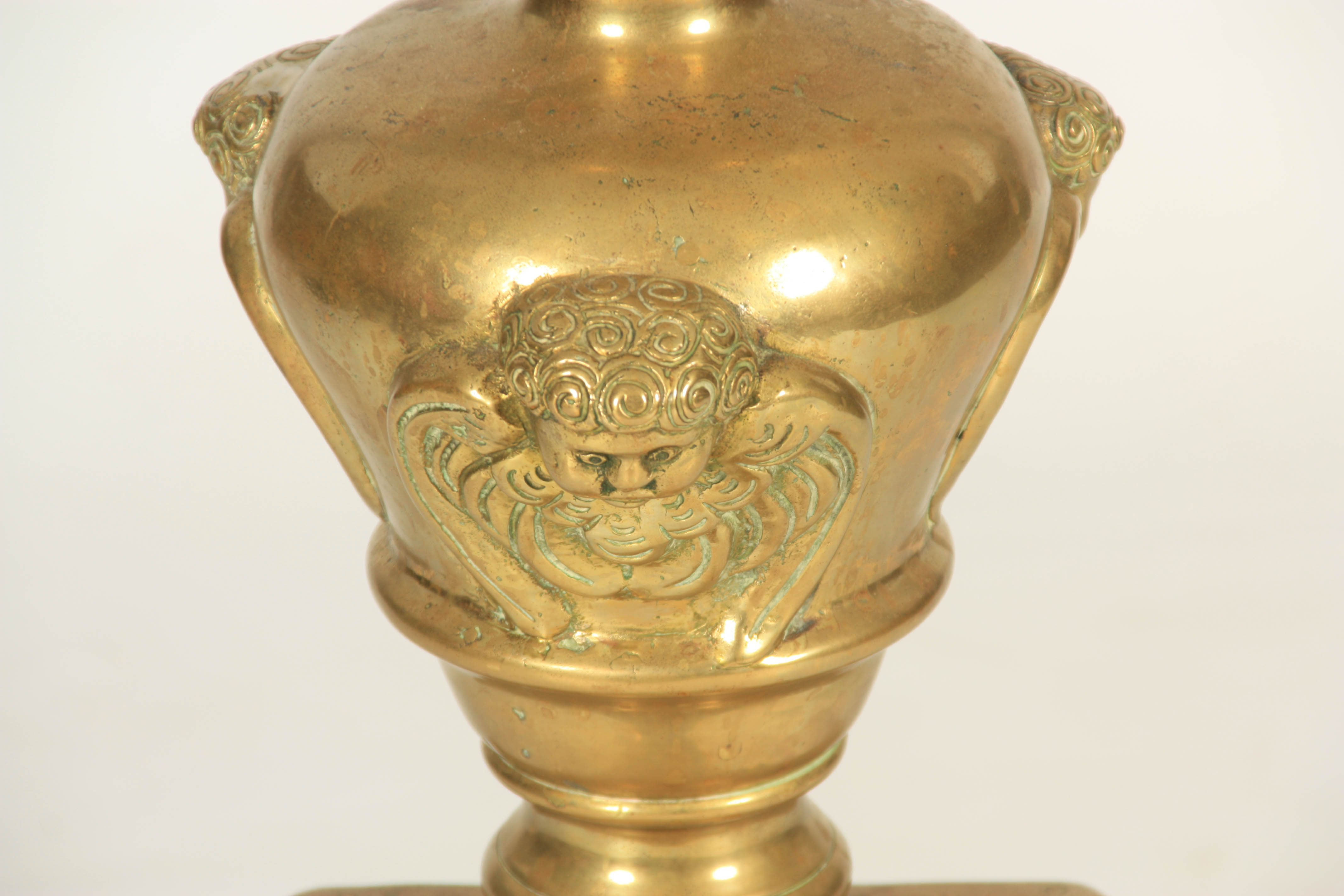 A LARGE EARLY 18TH CENTURY CAST BRASS TORCHERE with barley twist column and winged masked tripod - Image 4 of 6