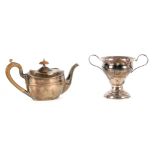 AN EDWARD VII SMALL OVAL SILVER TEAPOT with hinged lid, shoulder bands and shaped wood handle 23cm