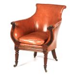 A LATE REGENCY ROSEWOOD FRAMED AND STUDDED TAN LEATHER UPHOLSTERED LIBRARY CHAIR WITH LOOSE