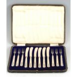 A GEORGE V CASED SET OF SIX SILVER HANDLED PASTRY KNIVES AND FORKS - hallmarked Sheffield 1913 -14