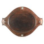 A 1920's A.E. JONES HAND BEATEN COPPER TRAY with silver roundels, reeded and tied cast applied