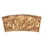 A 19TH CENTURY FRENCH PLASTERWORK ARCHED PANEL depicting a city siege 37cm across