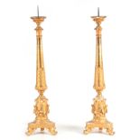 A PAIR OF 18TH CENTURY CONTINENTAL CARVED GILT GESSO CORNER TORCHERES having water gilded fronts,