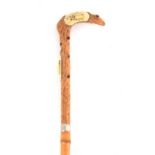 A LATE 19TH CENTURY JAPANESE WALKING STICK with naturalistic carved boxwood handle having inset