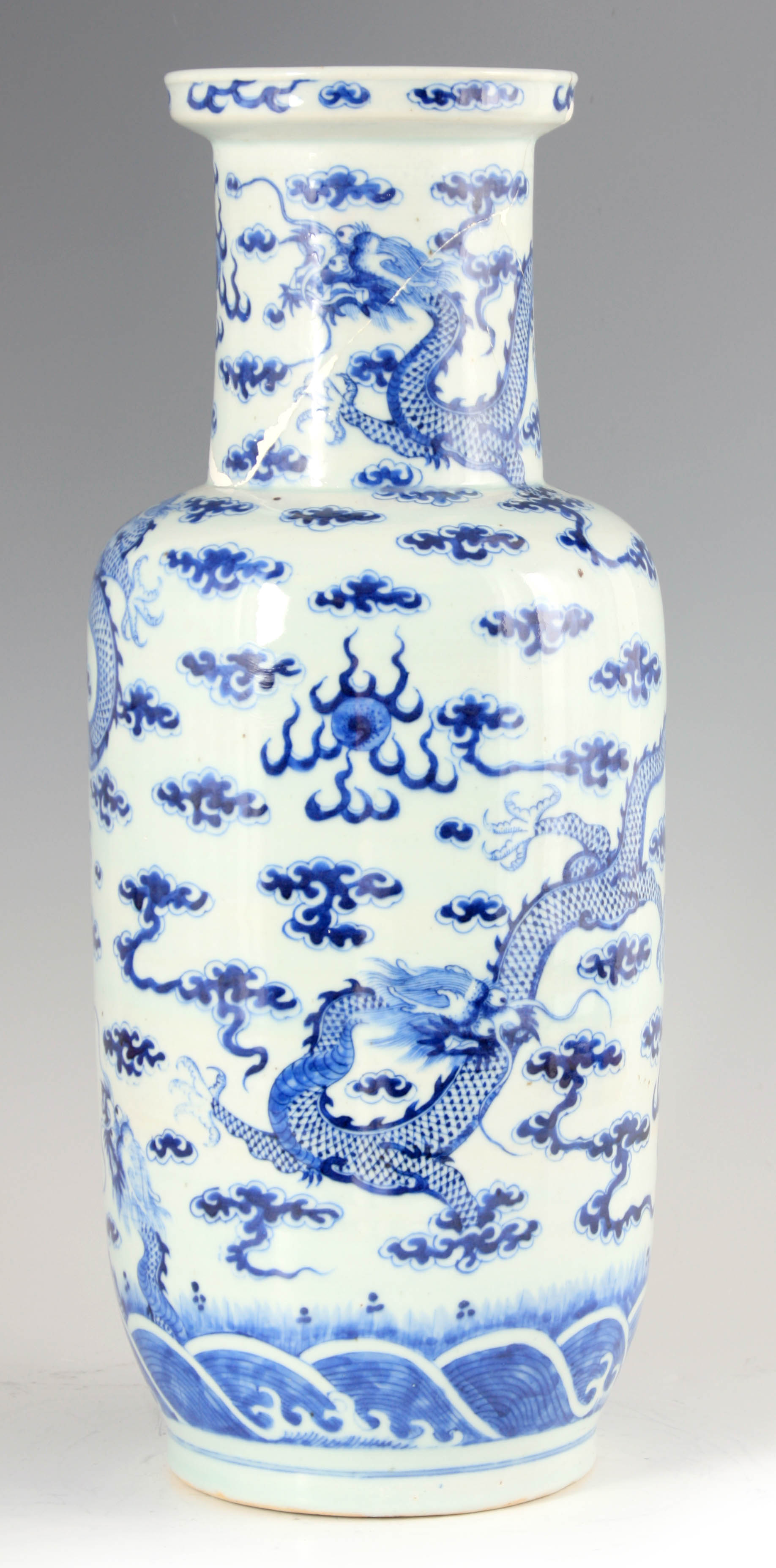 A 19TH CENTURY CHINESE BLUE AND WHITE PORCELAIN VASE decorated with entwined dragons amongst