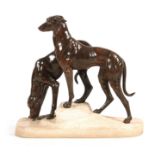 JULES-EDMUND MASSON A LARGE BRONZE PATINATED ART DECO SCULPTURE MODELLED AS TWO HOUNDS ON A ROCKY