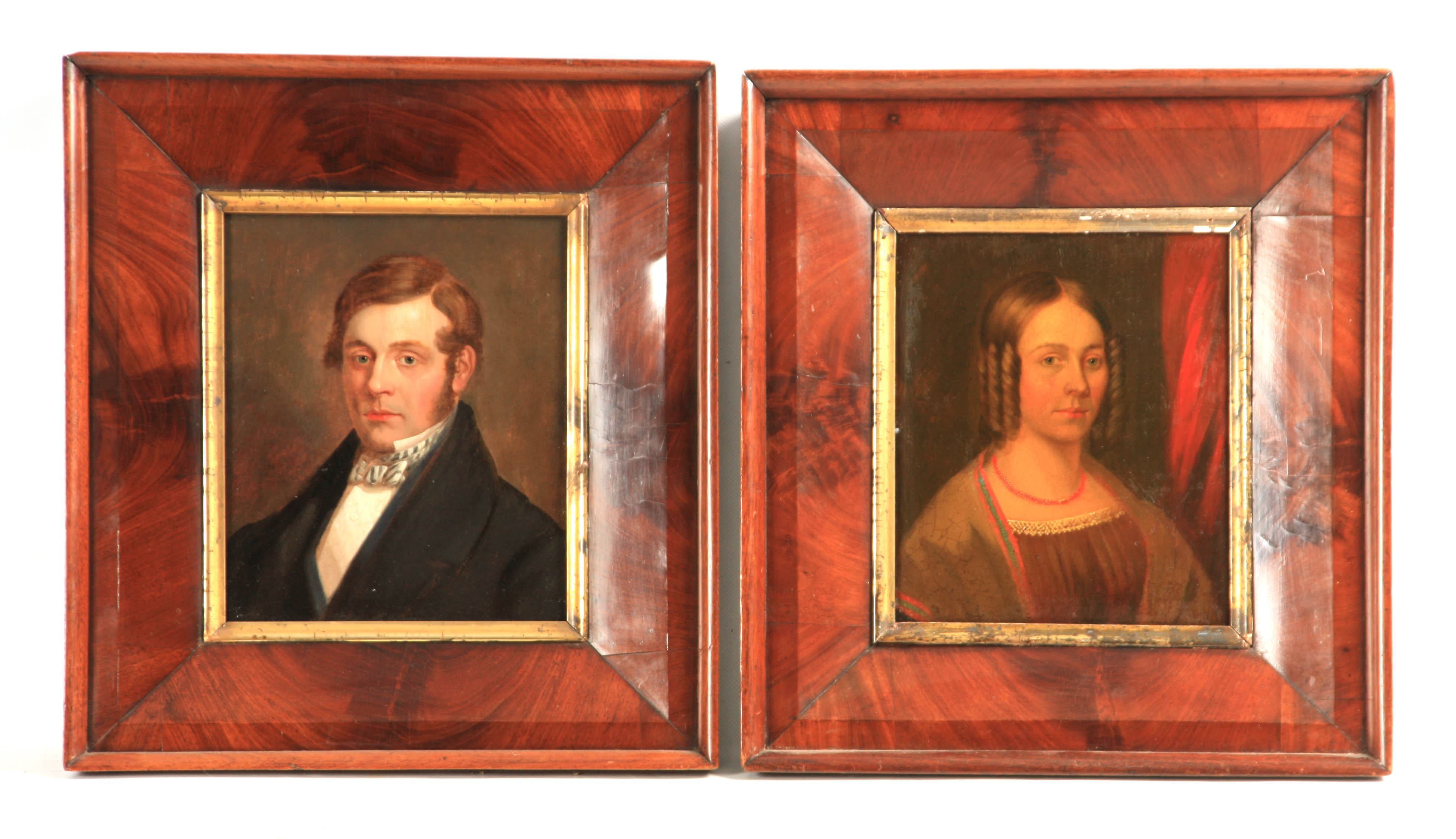 A PAIR OF REGENCY OILS ON BOARD Portraits of a husband and wife 26.5cm high 22cm wide - in figured