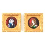 P BONNAUD (1865 - 1930) A FINE PAIR OF CONVEX LIMOGES ENAMEL CIRCULAR PLAQUES depicting the head and