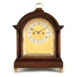 T. LANCASTER WHIPP, ROCHDALE AN EARLY 20TH CENTURY DOUBLE FUSEE BRACKET CLOCK the arched case with