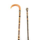 TWO 19TH CENTURY SECTIONAL HORN TAPERING WALKING STICKS one with a hooped rhino horn handle 92cm