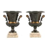 A STYLISH PAIR OF LATE 19TH CENTURY BRONZE AND GILT BRONZE EMPIRE STYLE TWO HANDLED URN SHAPED