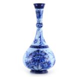 A FLORIANWARE MOORCROFT SLENDER NECK BOTTLE VASE with stylised piped floral decoration - with