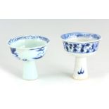 TWO CHINESE PORCELAIN BLUE AND WHITE STEM CUPS one decorated with a dragon 9.5cm high 10cm