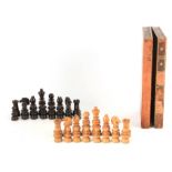 A 19TH CENTURY OVER-SIZED BOXWOOD AND ROSEWOOD WEIGHTED CHESS SET encased in a folding leathered