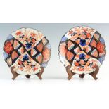 A GOOD PAIR OF LATE 19TH CENTURY SCALLOP EDGE IMARI PLATES with multi-coloured random floral and