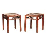 A PAIR OF 19TH CENTURY CHINESE HARDWOOD JARDINIERE TABLES with panelled tops and open carved pierced