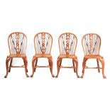 AN UNUSUAL SET OF FOUR YEW-WOOD, ASH AND ELM SINGLE WINDSOR CHAIRS with hooped backs enclosing