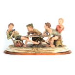 A NAPLES CAPODIMONTE LARGE OVAL FIGURE GROUP “The young card players” signed to base 56.5cm wide