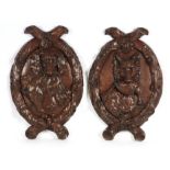 A LARGE PAIR OF 19TH CENTURY CARVED OAK WALL PLAQUES modelled as a fox with pheasant and a hound