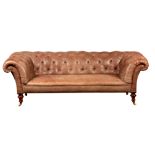 A GOOD 19TH CENTURY LEATHER DEEP BUTTON UPHOLSTERED CHESTERFIELD THREE SEATER SETTEE with mahogany