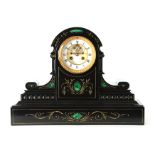 A LATE 19TH CENTURY BLACK SLATE AND MALACHITE PANELLED MANTEL CLOCK with scratch carved gilt