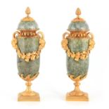 A PAIR OF LATE 19TH CENTURY FRENCH GREEN MARBLE AND ORMOLU MOUNTED URNS AND COVERS with mask head