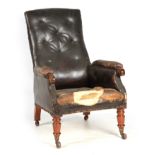 A LATE REGENCY BUTTON UPHOLSTERED LEATHER LIBRARY CHAIR with shaped button back and mahogany