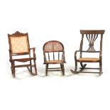 A GROUP OF THREE EARLY 20TH CENTURY FRUITWOOD CHILD'S ROCKING CHAIRS with Bergere seats and backs