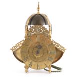 A LATE 17TH CENTURY BRASS WINGED LANTERN CLOCK the large bell with turned finial supported on