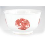 A CHINESE FOOTED BOWL decorated with red dragon medallions on a neutral ground 14cm diameter 8cm