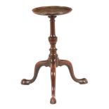 A MID 18TH CENTURY MAHOGANY CANDLE STAND with moulded dished top mounted on vase-shaped turned