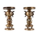 A PAIR OF LATE 19TH CENTURY MEIJI JAPANESE BRONZE BURNERS ON STANDS the revolving lift out tops with
