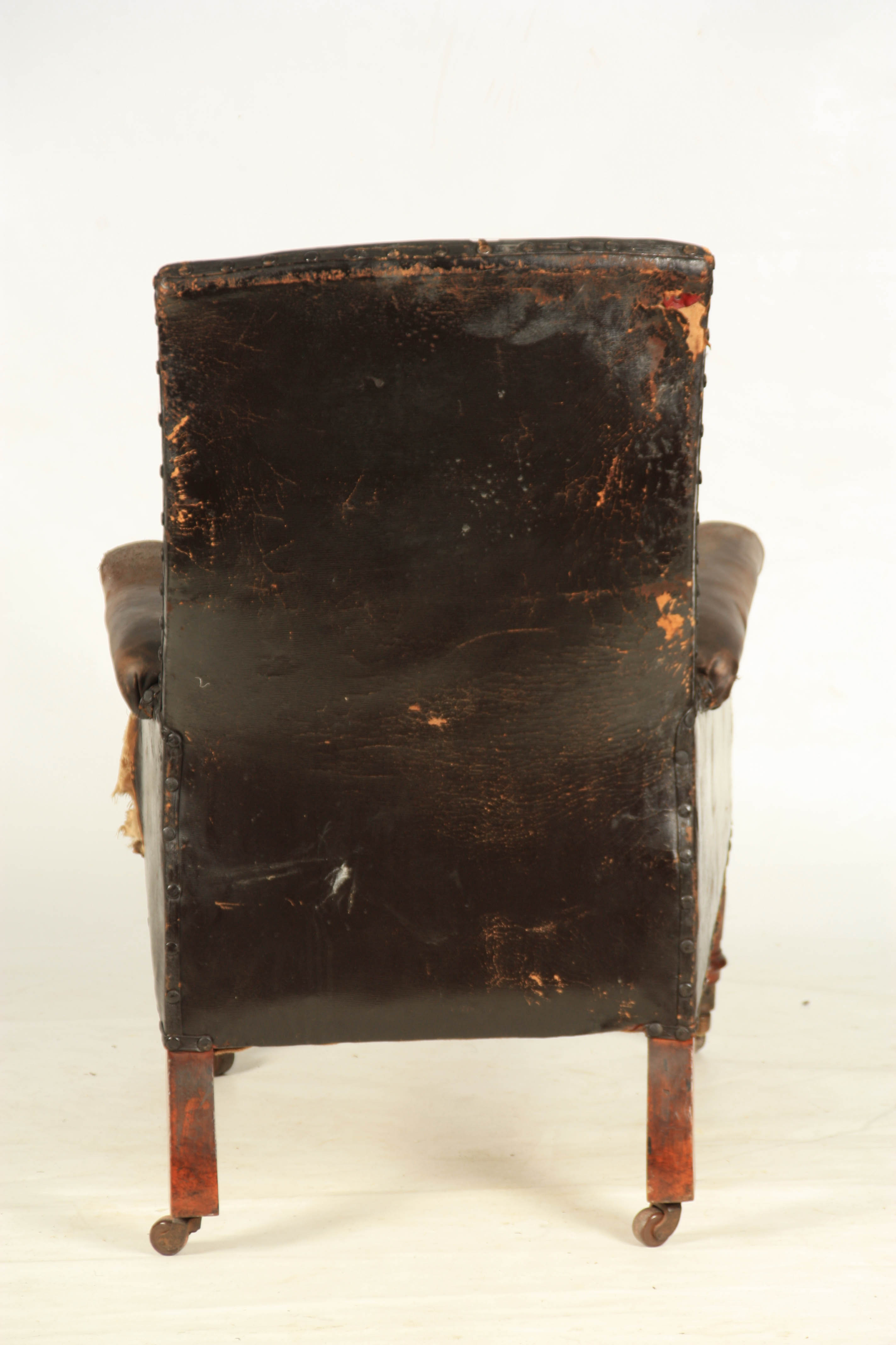 A LATE REGENCY BUTTON UPHOLSTERED LEATHER LIBRARY CHAIR with shaped button back and mahogany - Image 8 of 8