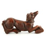 A 19TH CENTURY CARVED OAK HERALDIC GREYHOUND possibly from a staircase 49cm long