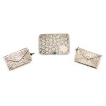 A COLLECTION OF THREE SILVER STAMP BOXES the largest having foliate engraved decoration opening with