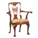 A FINE GEORGE I WALNUT OPEN ARMCHAIR with scrolled vase-shaped back, pronounced swept arms and