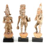 A SET OF THREE EARLY GILT CARVED TIBETAN FIGURES OF STANDING BUDDHAS numbered on the bases and