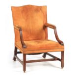 A FINE GEROGE III MAHOGANY TAN LEATHER UPHOLSTERED GAINSBOROUGH CHAIR OF GENEROUS SIZE with shaped