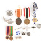 A COLLECTION OF GERMAN NAZI MEDALS together with various badges and a signet ring (12)