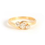 A LADIES 18CT YELLOW GOLD THREE STONE DIAMOND RING the three brilliant-cut setting of app.0.75ct, on