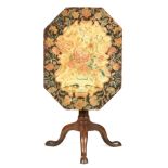 A GEORGE II MAHOGANY TILT TOP OCCASIONAL TABLE with floral tapestry cover top; the base with